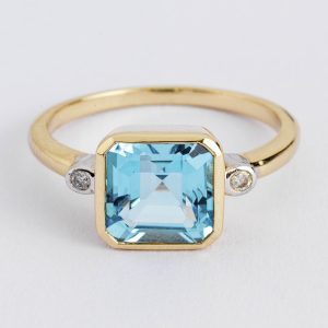 Blue topaz and diamond ring