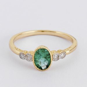 Oval emerald and diamond ring
